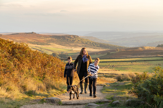 Family walking their dog