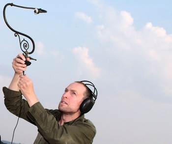 Mark Gwynne Jones holds an aerial in the air