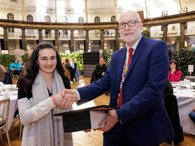 Amy Brittain-Cartlidge receives her award from Buxton & Leek College Principal Len Tildsley